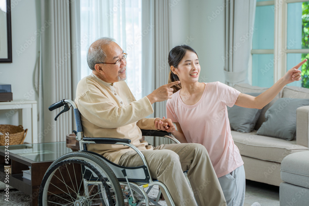 Caregiver woman comforting senior man sitting on wheelchair at nursing home,Loving caregiver taking care and express health care sympathy of senior man. Caregiver woman comforting senior man sitting on wheelchair at nursing home,Loving caregiver taking care and express health care sympathy of senior man.