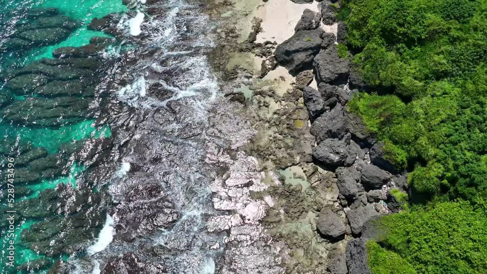 4K Aerial view top view drone move Beautiful topical beach with rock. empty and clean beach and green forest. Beautiful Liuqiu island beach is famous tourist destination at Taiwan Strait 4K Aerial view top view drone move Beautiful topical beach with rock. empty and clean beach and green forest. Beautiful Liuqiu island beach is famous tourist destination at Taiwan Strait
