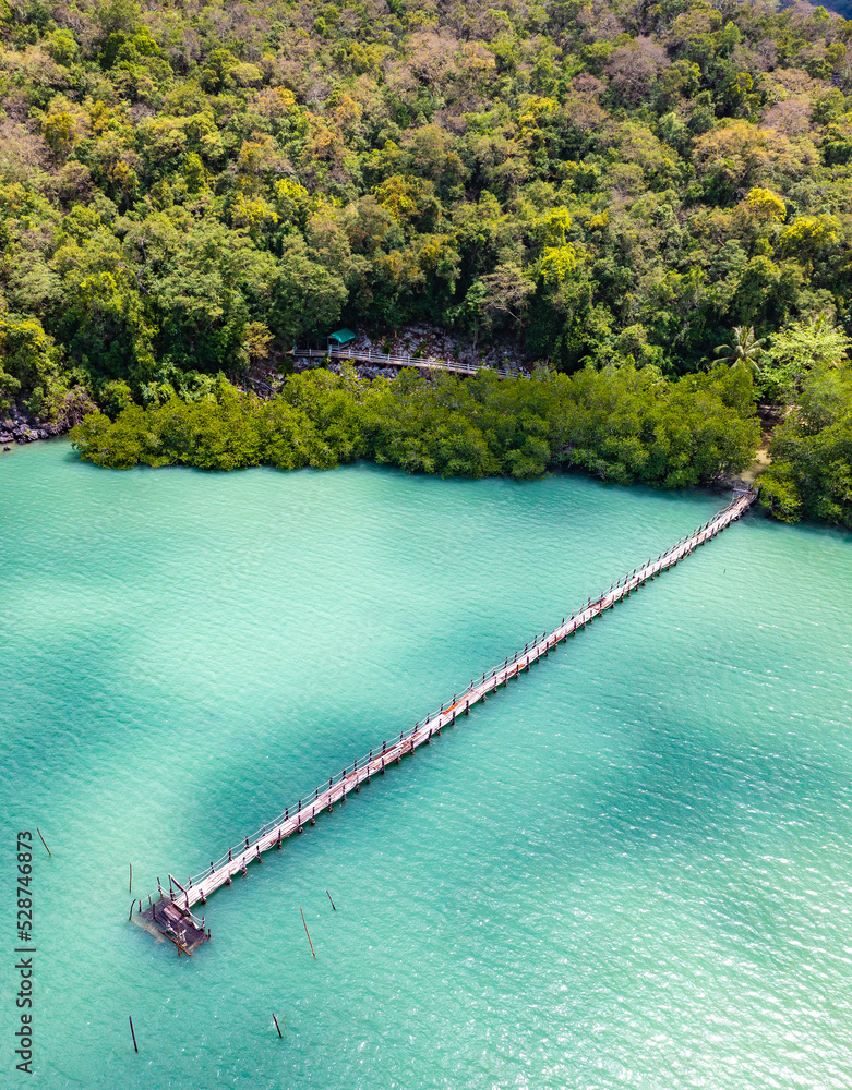 Fototapeta premium Wooden bridge at Ao Talet or Ta Lhet bay, Nakhon si Thammarat, Thailand