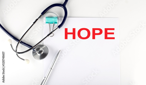 Slika na platnu HOPE text written on the paper with a stethoscope