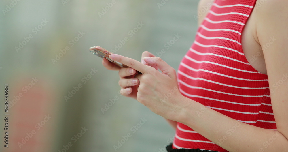 Closeup of woman hands holding smartphone
