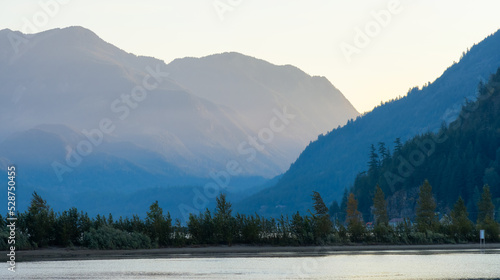 Harrison Lake during Sunny Summer Morning Sunrise. Canadian Nature Landscape Background. Harrison Hot Springs, British Columbia, Canada.