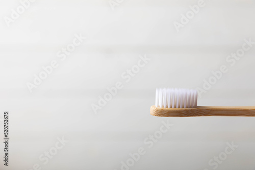 Toothbrushes. Oral care. Dental care. Composition with bamboo toothbrushes on a light background. Eco friendly.Copy space. Place for text.Fletley