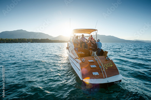 A group of friends have a toast while they cruise on a yacht.