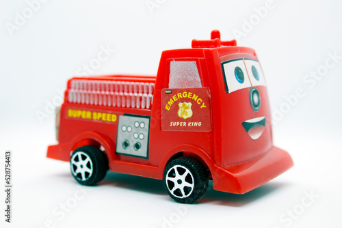 Toy red fire truck isolated on white background