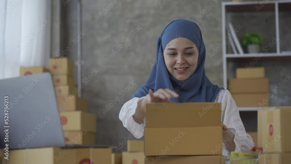 A woman works and checks boxes for parcels of goods to be delivered at home. small online business owner
sme A woman works and checks boxes for parcels of goods to be delivered at home. small online business owner
sme