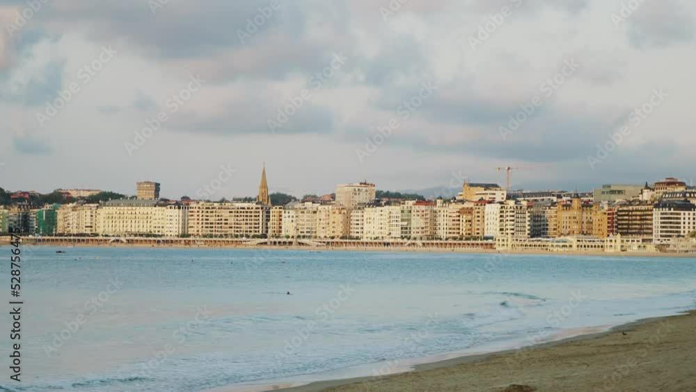 Light waves wash sand against buildings in San Sebastian Light waves wash sand against buildings in San Sebastian