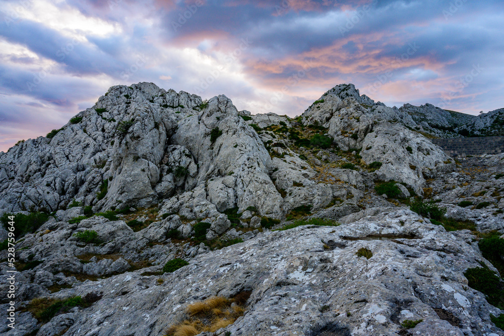 Colorful sky from the setting sun over Tulovegrede in the Croatian Velebit mountains.