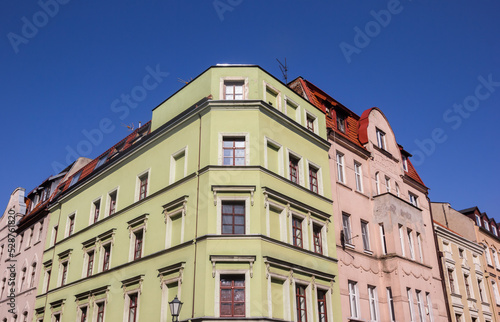 Colorful corner house in historic city Torun, Poland