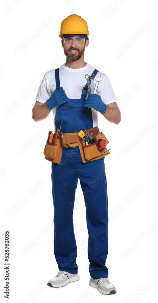Professional builder in uniform with tool belt isolated on white Professional builder in uniform with tool belt isolated on white