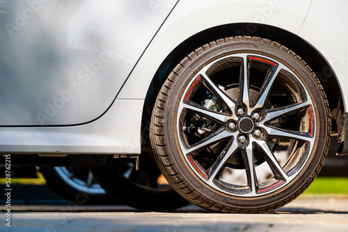 sports car wheels, low profile tires on aluminum rims, closeup © ako-photography