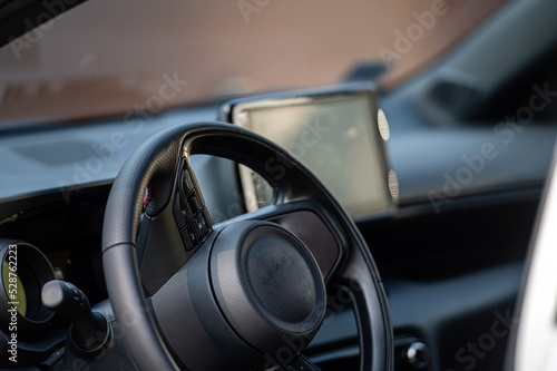 Interior view car with modern steering wheel, dashboard. Closeup. Shallow depth of field © ako-photography