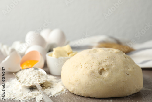 Wheat dough and products on table, closeup. Cooking pastries