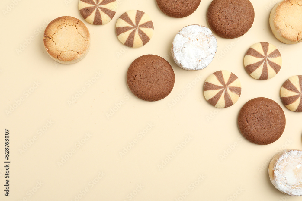 Delicious cookies on beige background, flat lay. Space for text Delicious cookies on beige background, flat lay. Space for text