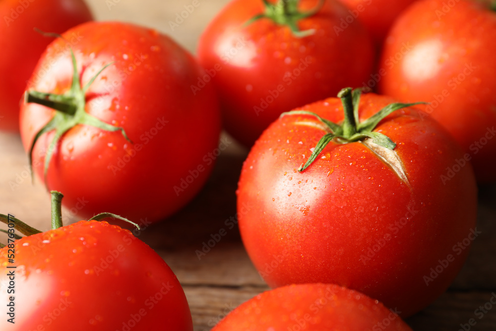Fresh ripe tomatoes on wooden table, closeup Fresh ripe tomatoes on wooden table, closeup