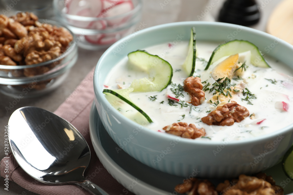 Delicious cold summer soup on table, closeup Delicious cold summer soup on table, closeup