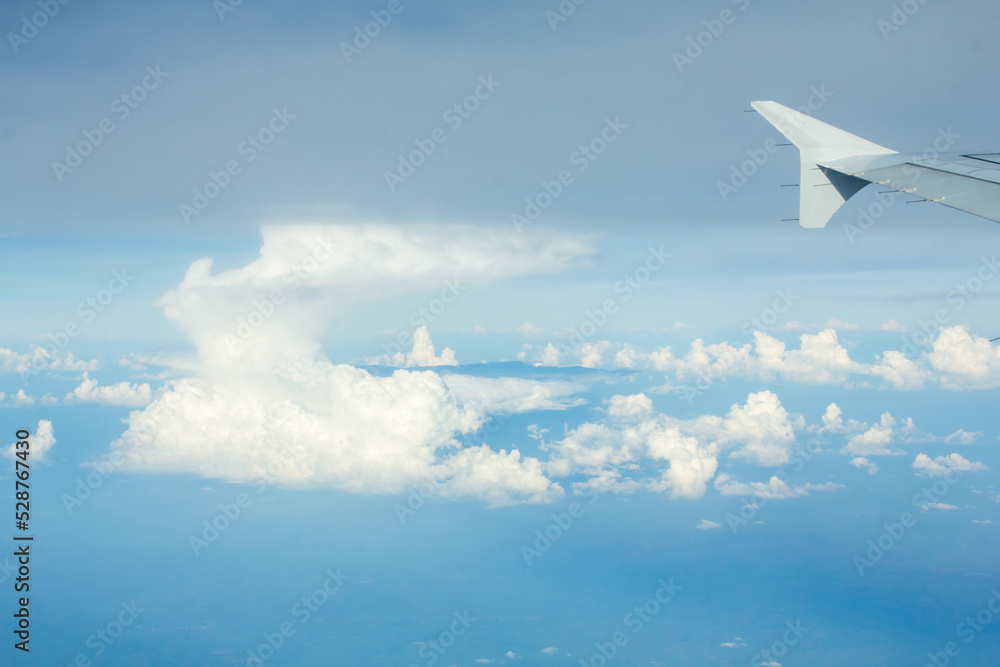 Airplane Window View with Airplane wing and Blue Sky Airplane Window View with Airplane wing and Blue Sky