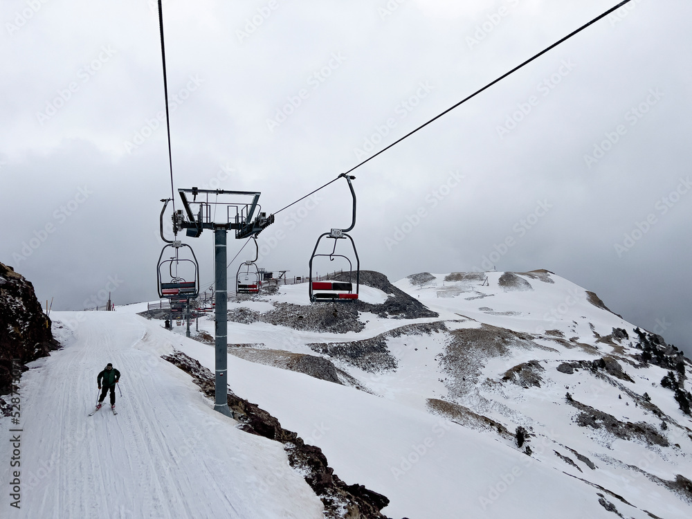 ski resort with ski lifts and skiers ski resort with ski lifts and skiers