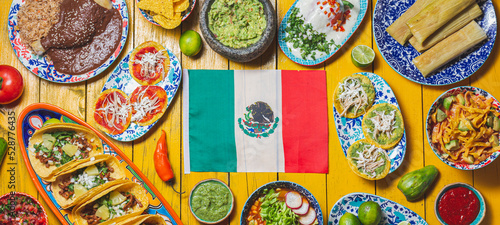 Mexican festive food for independence day independencia - around mexican flag. Top view   Yellow background.