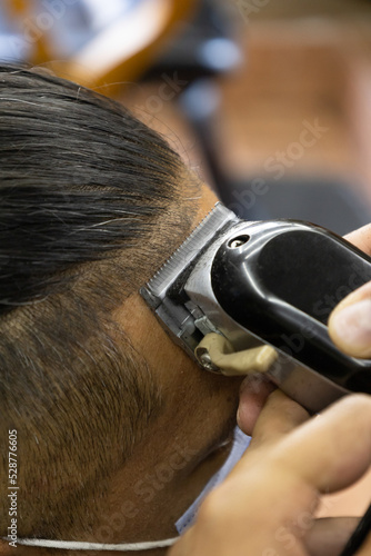 razor making a haircut, work in a barbershop, personal care, beauty and style, hairdresser tool © Alejandro