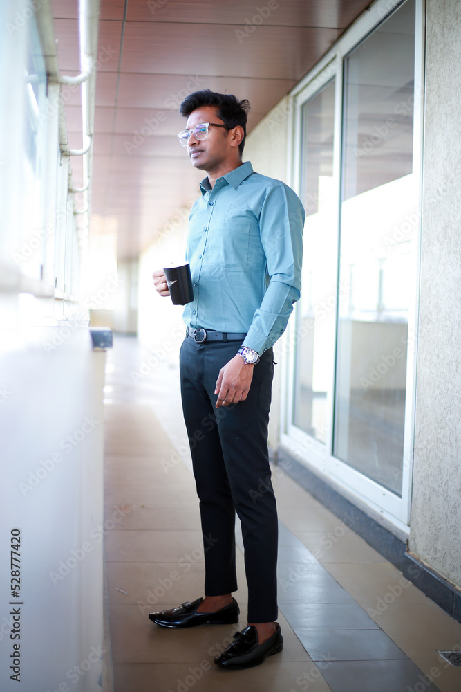 Asian man is drinking coffee, deep in thoughts concept Asian man is drinking coffee, deep in thoughts concept