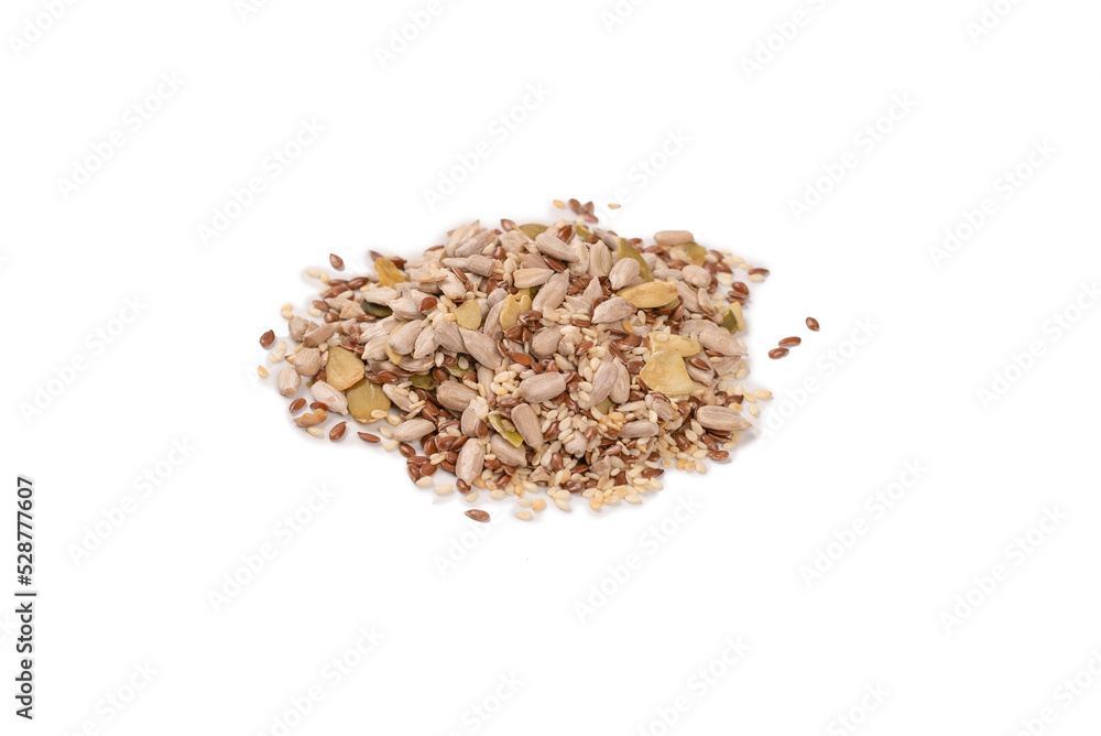 Mix of seeds for a salad. A pile of mixed seeds isolated on white background.