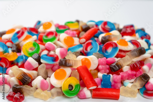 Tasty mix of jelly colorful candies isolated on a white background.