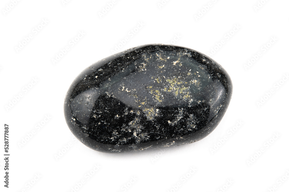 A piece of polished black onyx mineral with white patches A piece of polished black onyx mineral with white patches