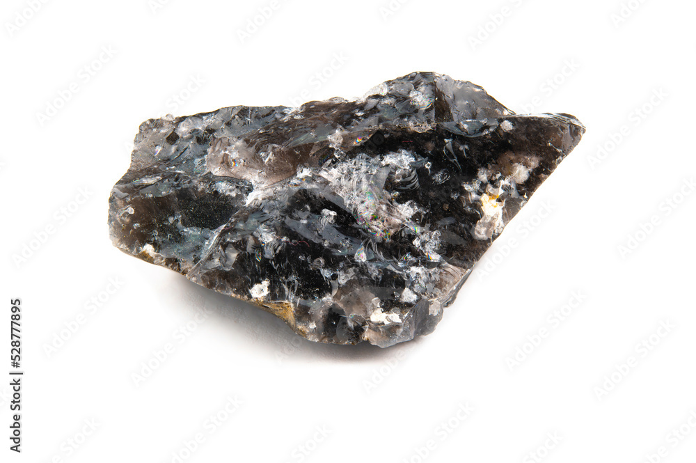 A shard of a raw, translucent black obsidian crystal A shard of a raw, translucent black obsidian crystal