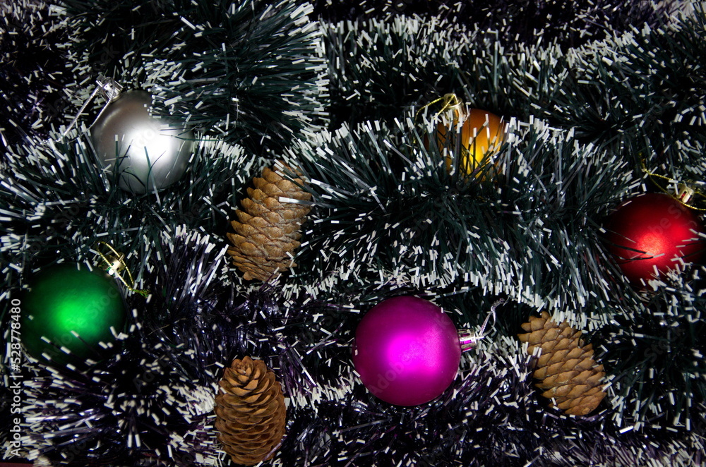 Christmas decorations. Christmas tree toys on tinsel.