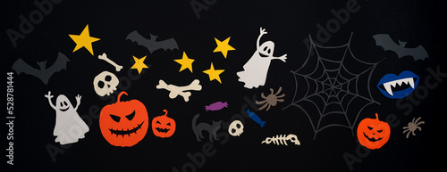 Halloween banner. Funny halloween characters on black paper.
