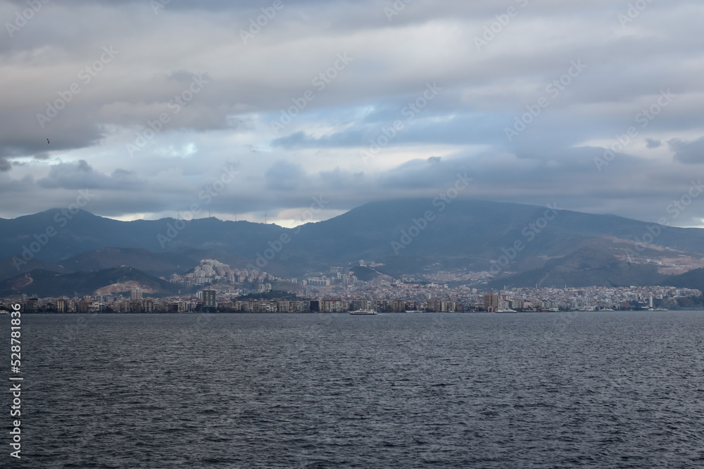 Mountains and the Aegean Sea on the coast of Izmir with copy space and sunrays