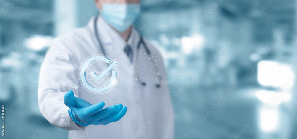 Doctor shows a symbol of well done work . Doctor shows a symbol of well done work .