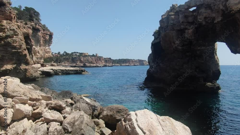 Mallorca Es Pontas rock arch Icon. Natural wonder of the coast of Santany Mallorca Mallorca Es Pontas rock arch Icon. Natural wonder of the coast of Santany Mallorca