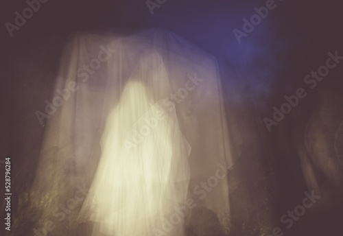 scary ghost in foggy night Halloween background