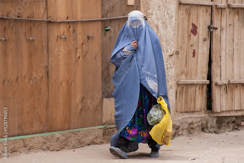 Bamyian, Afghanistan - May 2004: Woman in burqa in the Bamyian Valley