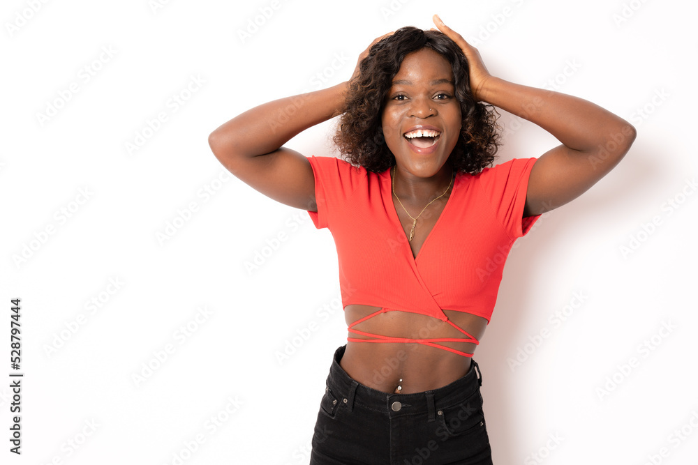 Beautiful female half-length portrait isolated on white studio background. Young surprised woman holding hands by head, looking at camera. Human emotions, facial expression concept. Beautiful female half-length portrait isolated on white studio background. Young surprised woman holding hands by head, looking at camera. Human emotions, facial expression concept.