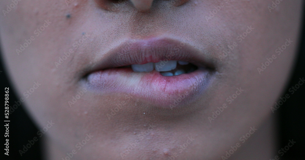 Fototapeta premium Sensual african woman biting lips in macro