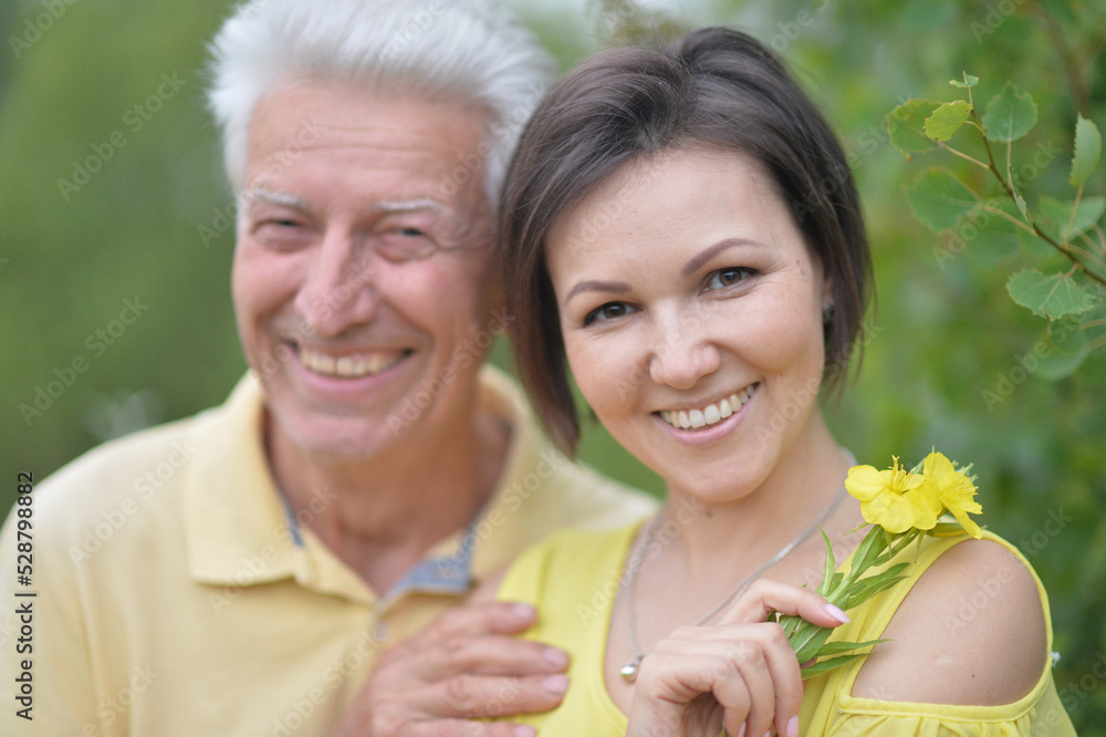 Portrait of a beautiful elderly man with his daughter Portrait of a beautiful elderly man with his daughter