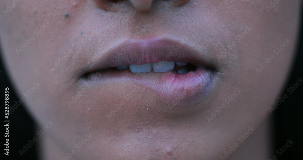 Fototapeta premium Sensual african woman biting lips in macro