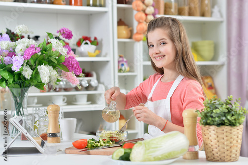 Portrait of girl in the kitchen cook