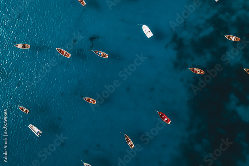 Colorful boats in the ocean, drone view, top view photo