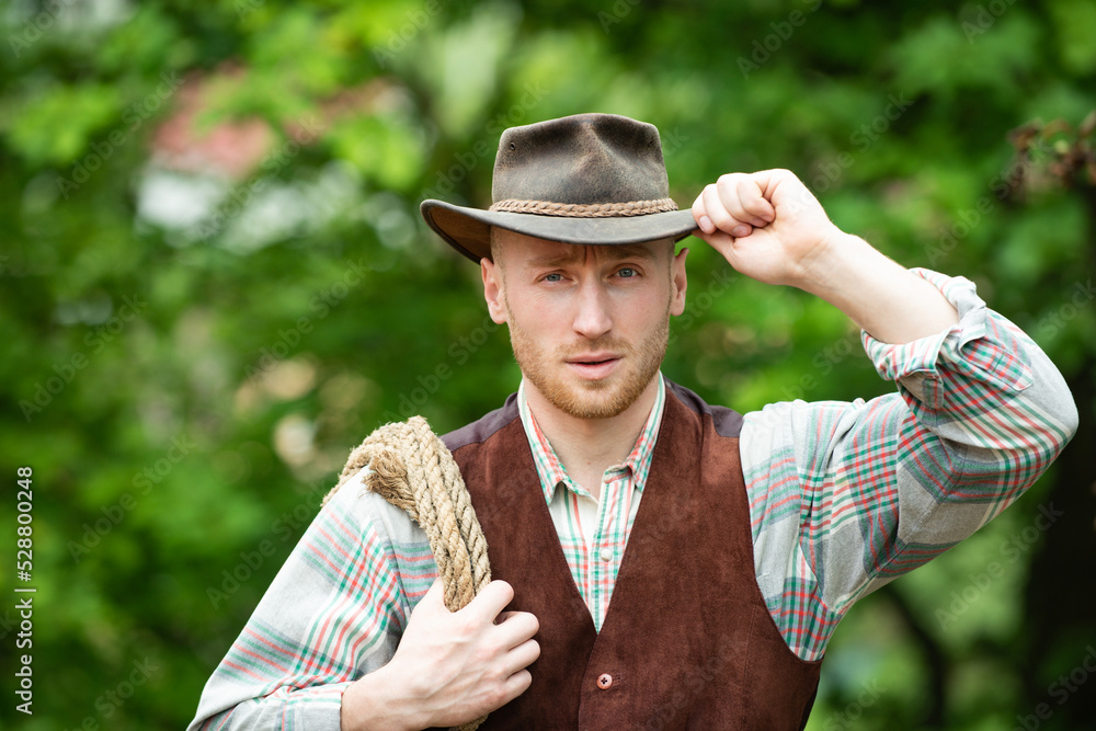 Cowboy farmer man in country side wearing western cowboy hat. Cowboy ...
