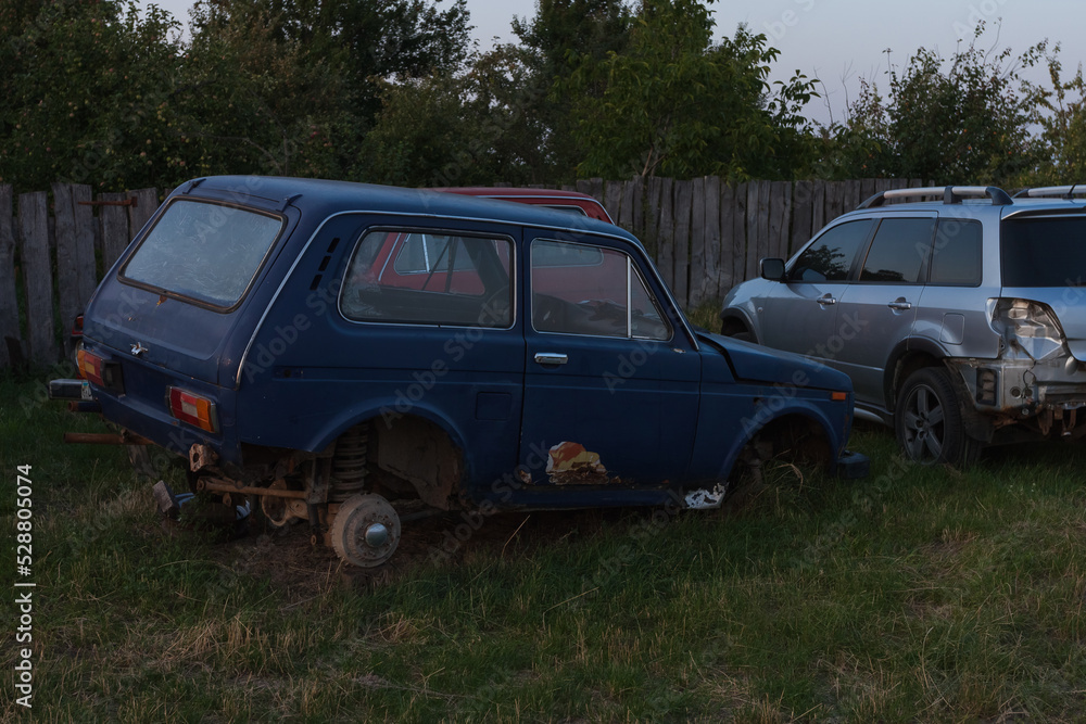 A broken and wheelless Soviet car