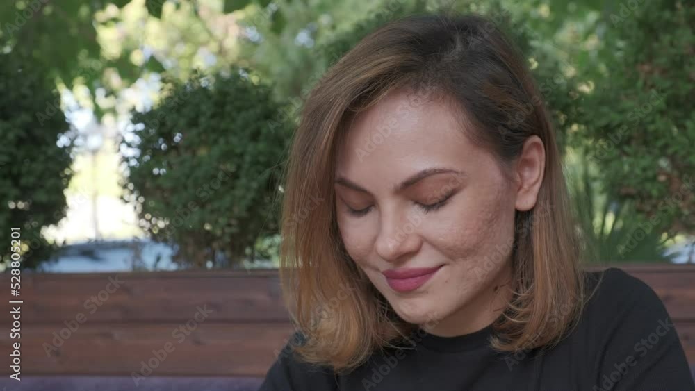 Portrait of woman siting by the table outdoors Portrait of woman siting by the table outdoors