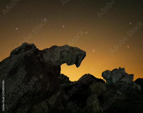 Ursa Major constellation above some rock formations in a warm summer night.  photo