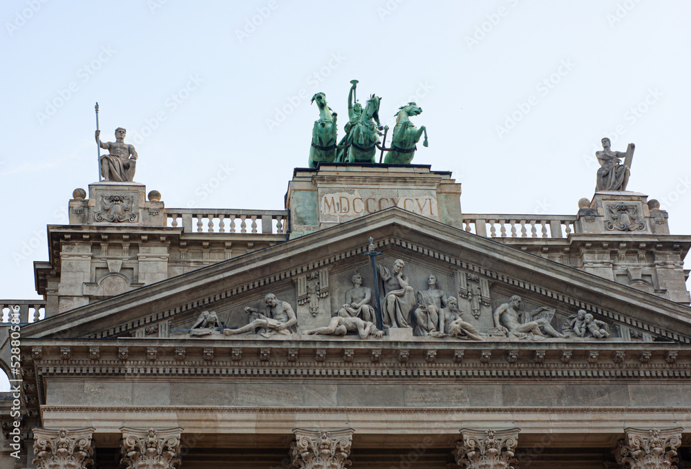 Portion of the exterior of the Museum of Ethnography in Budapest, Hungary. The building is located at Kossuth Square near the Hungarian Parliament House. Many statues are decorating the facade,