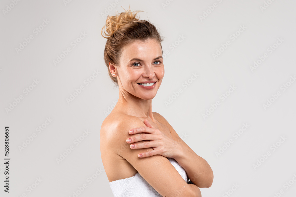 Beauty Concept. Portrait Of Attractive Middle Aged Woman Wrapped In Bath Towel