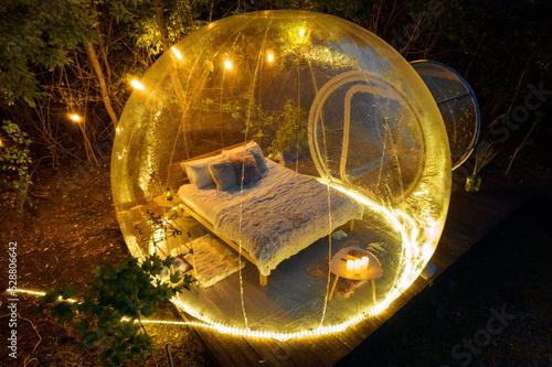 Transparent bubble tent at glamping at night