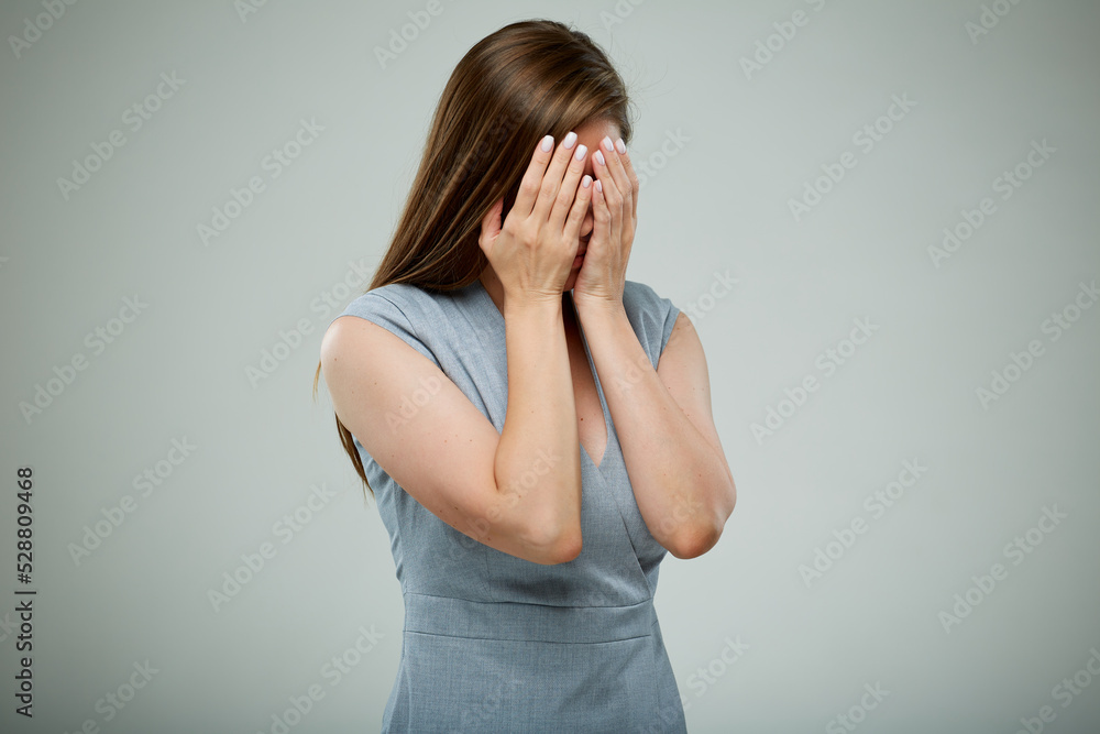 Fear concept. Woman hide her face with hands. isolated female portrait. Fear concept. Woman hide her face with hands. isolated female portrait.